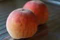 Rosy ripe Kuban peach close-up on a metal table