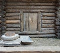 Rotary discoid mill stone for hand-grinding a grain into flour. Medieval hand-driven millstone grinding wheat. The Royalty Free Stock Photo