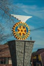Rotary International logo sculpture on pedestal Royalty Free Stock Photo