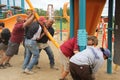 Rotary members from the community helping to build a playground for children.