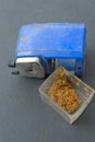 Rotary pencil sharpener with pencil scrap Royalty Free Stock Photo