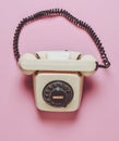 Rotary retro phone on a pink pastel background. Hot line. Helpline. Top view. Royalty Free Stock Photo