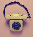 Rotary retro phone on a pink pastel background. Hot line. Royalty Free Stock Photo