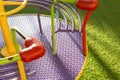 Rotary Swing playground on green grass.