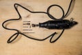 Rotary Tool and Bits on wooden table Royalty Free Stock Photo