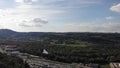 Rotating aerial view over Habsburg forest in direction of Brugg-West and Schinznach-Bad with Postauto and evening traffic in the