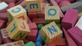 Rotating alphabetical and other toy wooden cubes