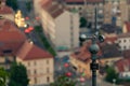 Rotating anemometer measuring wind speed placed on the hill overlooking the city Royalty Free Stock Photo