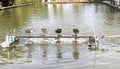 Paddle wheel aerator working for wastewater treatment in semi-natural ponds Royalty Free Stock Photo