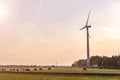 Rotating blades of a windmill propeller on blue sky background. Wind power generation. Pure green energy Royalty Free Stock Photo