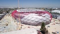 Rotating drone view of Intuit Dome arena under construction in Inglewood, California on a sunny day