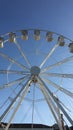 Rotating ferris wheel against the sky. Bottom view