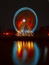 rotating ferris wheel at night in city of gdansk poland