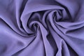 Rotating folds of knitted cotton fabric background