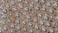 Rotating footage of loose Japanese Akoya pearls.