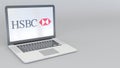 Rotating opening and closing laptop with HSBC logo. Computer technology conceptual editorial 4K clip