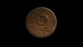 Rotating reverse of Japan coin 1 sen minted from 1916 till 1938 with inscription meaning ONE SEN. Isolated in black background.