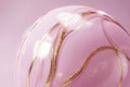 rotating sphere in pink, with delicate gold veins running through it, creating an elegant design