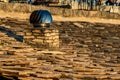 Rotating spinner chimney vent on stone roof