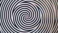 Rotating spiral circles.