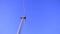 Rotating white blades of a windmill