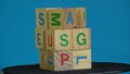 Rotating wooden cubes with alphabetical letters