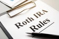 Roth IRA rules with stack of papers Royalty Free Stock Photo