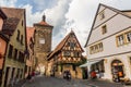 ROTHENBURG, GERMANY - AUGUST 29, 2019: Sieberstrum tower and Spitalgasse street in Rothenburg ob der Tauber, Bavaria