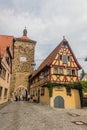 ROTHENBURG, GERMANY - AUGUST 29, 2019: Siebersturm tower and Spitalgasse street in Rothenburg ob der Tauber, Bavaria