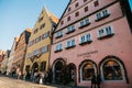Rothenburg ob der Tauber, Germany, December 30, 2016: Christmas shopping and decorated houses in the city`s main square Royalty Free Stock Photo