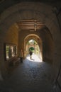 People pass through the western castle gate in the medieval town of Rothengurg ob der Tauber, Germany.