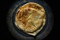 Roti Canai On Black Matte Plate. Generative AI