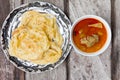 Roti canai with spicy curry