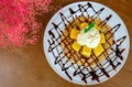 roti and ice cream with mango and chocolate syrup Royalty Free Stock Photo