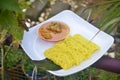 Roti jala or net bread with chicken curry gravy sauce on blurred background Royalty Free Stock Photo