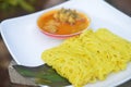 Roti jala or net bread with chicken curry gravy sauce on blurred background Royalty Free Stock Photo