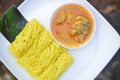 Roti jala or net bread with chicken curry gravy sauce on blurred background Royalty Free Stock Photo