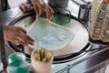 Roti Making, roti thresh flour by roti maker with oil. Indian traditional street food. Thai Pancake Banana And Egg . Royalty Free Stock Photo