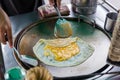 Roti Making, roti thresh flour by roti maker with oil. Indian traditional street food. Thai Pancake Banana And Egg . Royalty Free Stock Photo