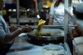 Roti Making, roti thresh flour by roti maker with oil. Thai Pancake topped with sweetened condensed milk and then sprinkle with