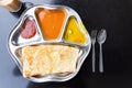 Roti prata or canai set with curry, dhal and sambal Royalty Free Stock Photo