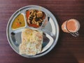 Roti Prata or Roti Canai with Teh tarik. Very famous food and drink in Malaysia Royalty Free Stock Photo