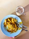 Roti ranai or roti parata with curry sauce and a cup of tea, popular Malaysian breakfast. Royalty Free Stock Photo