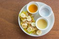 The Roti with sliced banana was served with sweetened condensed milk sugar and banana sauce , on top with sliced almond  put on Royalty Free Stock Photo