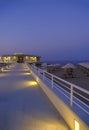 Rotonda al mare in the night across city lights, night sky, beach with sun umbrellas, long road in Senigallia, Italy Royalty Free Stock Photo