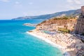 Rotonda beach full of people. Amazing Italian beaches. Sea promenade scenery in Tropea with high cliffs with built on top city