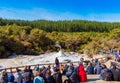 ROTORUA, NEW ZEALAND - OCTOBER 10, 2018: Crowds sitting to watch daily eruption of Lady Knox Geyser in Wai-o-Tapu