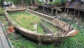 Rotted and abandoned row wooden boat