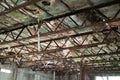 Rotted and corroded ceiling structure in abandoned shop