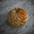 Rotten Apple lying on a gray background. Good and Bad Apples, Seasonal natural scene. Apple biting rotten bruise. Royalty Free Stock Photo